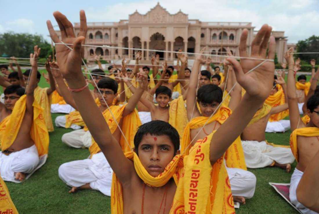 Indian young Brahmins from the Shree Swaminarayan Gurukul Vishwavidya Pratishthanam (SGVP) participate in the Janoi or 'sacred thread' changing ceremony in Ahmedabad on Aug. 20, 2013