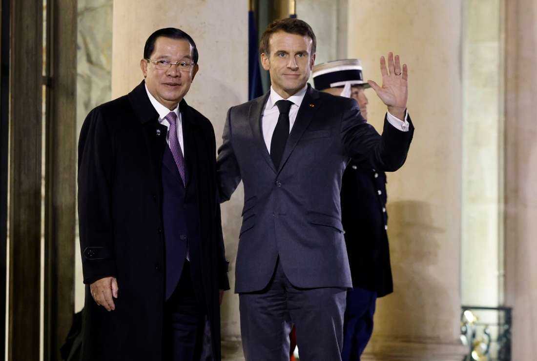 France's President Emmanuel Macron, right, greets Cambodia's Prime Minister Hun Sen at the Elysee Palace, in Paris, on Dec. 13, 2022