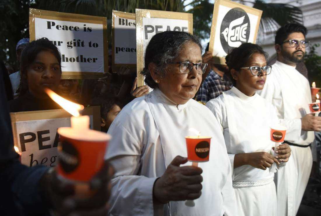 Christian priests along with devotees take part in a candlelight march for peace and harmony at St Paul's Church in Amritsar on Sept 3, 2022, following an incident in which four masked men allegedly vandalized a statue inside the church. An Evangelical Lutheran Church in Madhya Pradesh was recently broken into and the contents set on fire by suspected Hindu extremists