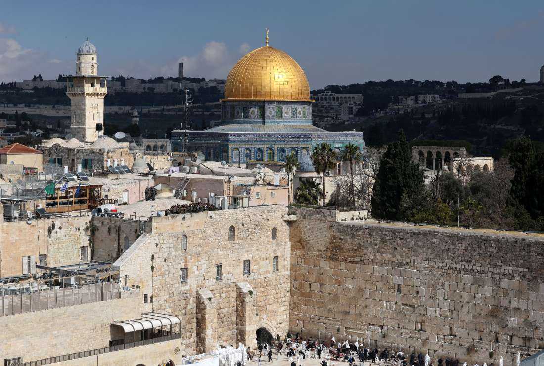 This picture shows a partial view of the Western Wall (Wailing Wall) and the Dome of the Rock Mosque in Jerusalem's Old City, on Feb. 12