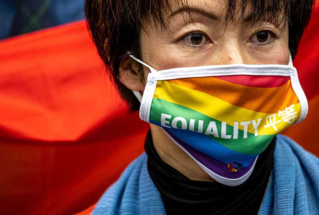 A woman attends a meeting with a group of LGBTQ and human rights campaigners to demand an anti-discrimination law for sexual minority people, in Tokyo on Feb. 14