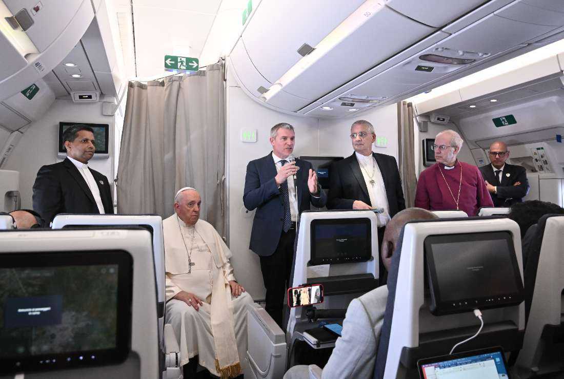 Archbishop of Canterbury Justin Welby (second from right), Pope Francis (second from Left), and Church of Scotland's Iain Greenshields (third from right) address the media while aboard the plane from Juba to Rome on Feb. 5 returning from the Pope's visit to the Democratic Republic of Congo and South Sudan