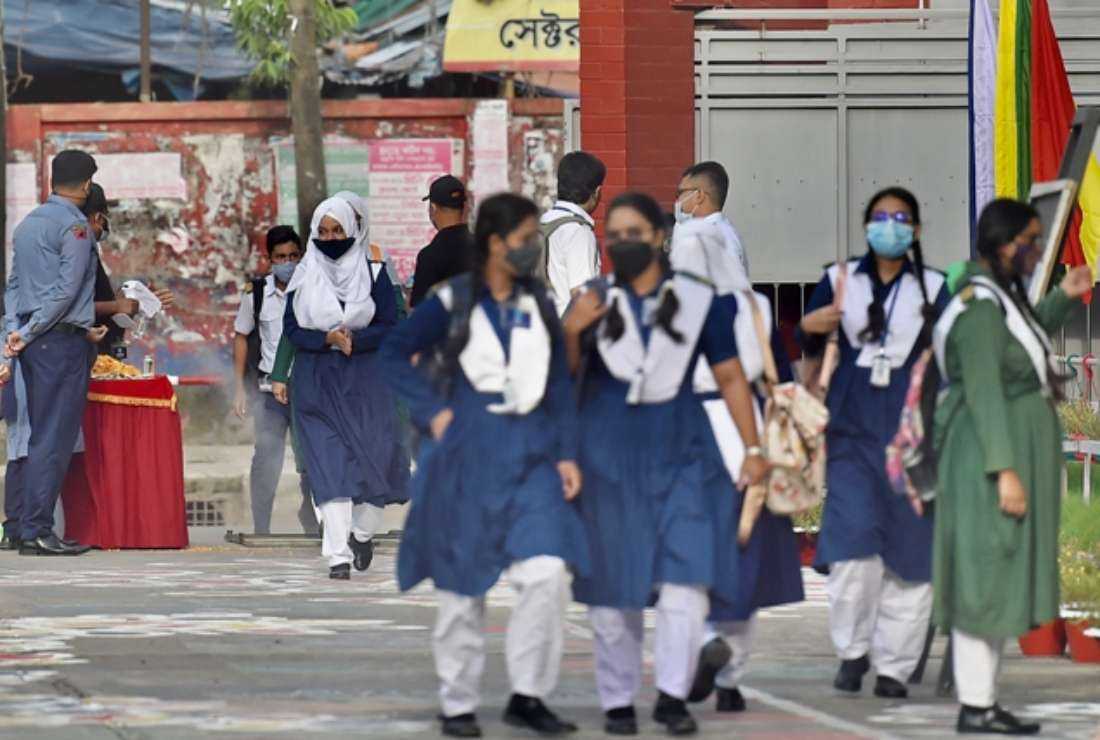 Students arrive to attend their classes at the Rajuk Uttara Model College in Dhaka on Sept 12, 2021, as Bangladesh schools reopened after 18 months in one of the world's longest shutdowns due to the Covid-19 coronavirus pandemic