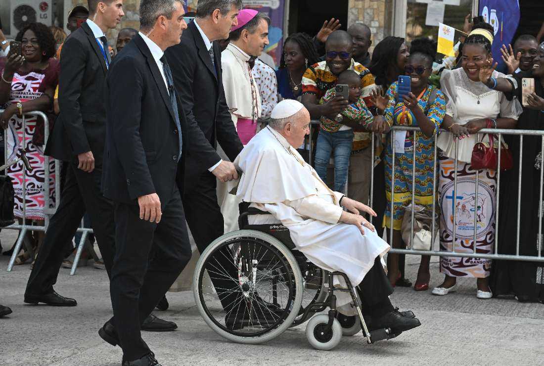 Pope Francis (center), seated in a wheelchair, arrives for a meeting with Bishops at the National Episcopal Conference of Congo (CENCO) in Kinshasa, Democratic Republic of Congo on Feb. 3