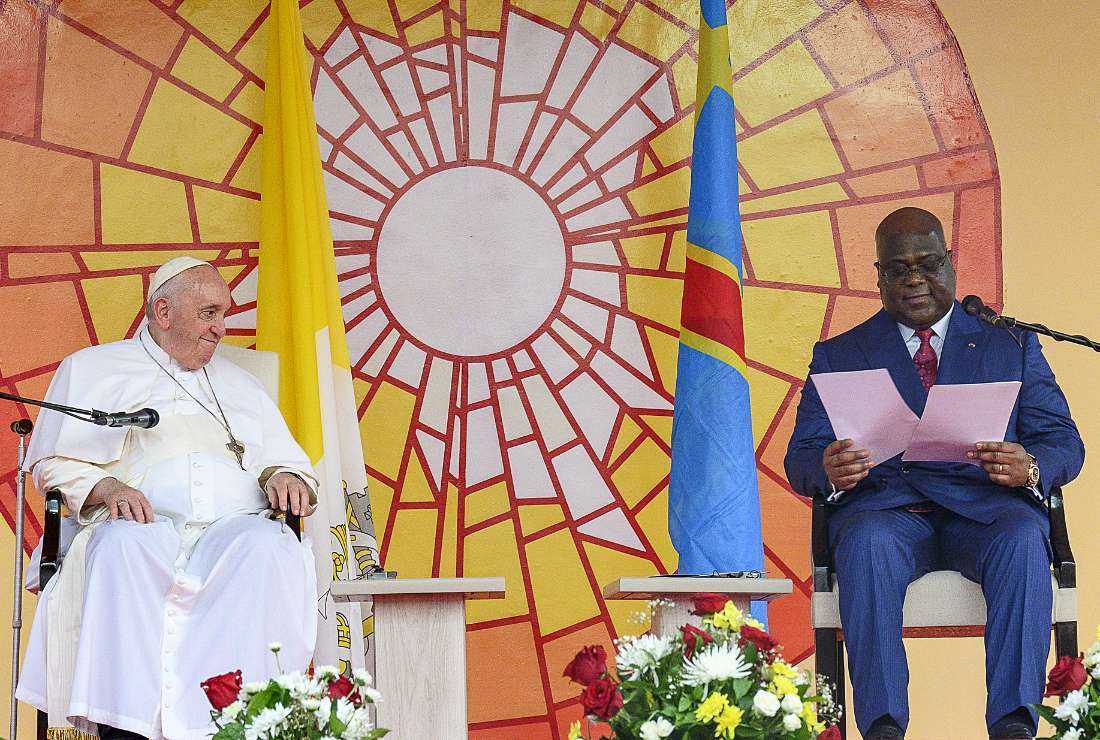 Pope Francis (left) looks at Democratic Republic of the Congo's President Felix-Antoine Tshisekedi delivering a speech in the garden of the Palace of the Nation during the meeting of the authorities, the civil society and the diplomatic corps in Gombe, Kinshasa on Jan. 31