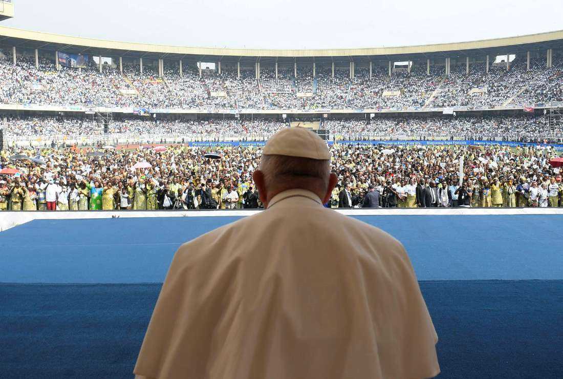 This handout photo taken and released on Feb. 2 by the Vatican Media shows attendees gathering during Pope Francis' (front) meeting with young people and catechists at Martyrs' Stadium in Kinshasa, Democratic Republic of Congo (DRC)
