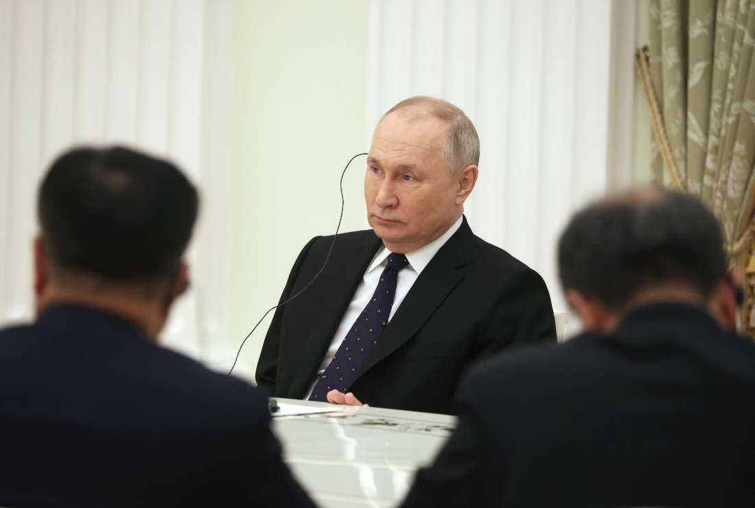 Russian President Vladimir Putin attends a meeting with China's Director of the Office of the Central Foreign Affairs Commission Wang Yi (not pictured) at the Kremlin in Moscow on Feb. 22
