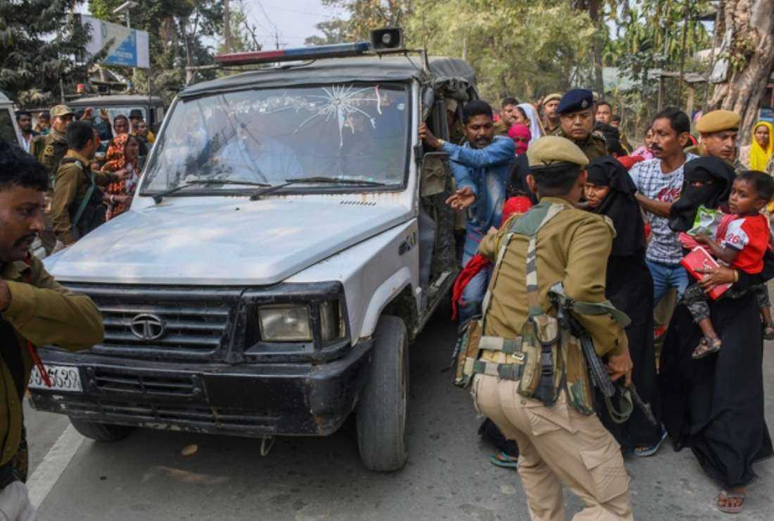Police personnel arresting people allegedly involved in child marriages to present before a court as their relatives react, near Mayong police station in Morigaon district of Assam on Feb. 4, 2023