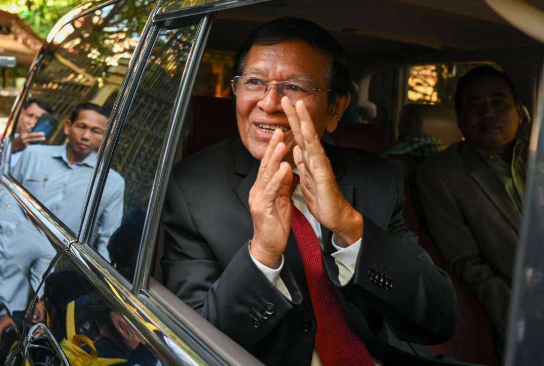 Kem Sokha, former leader of the now-dissolved Cambodia National Rescue Party (CNRP), greets the media at his home before going to Phnom Penh Municipal Court for the verdict in his trial in Phnom Penh on March 3