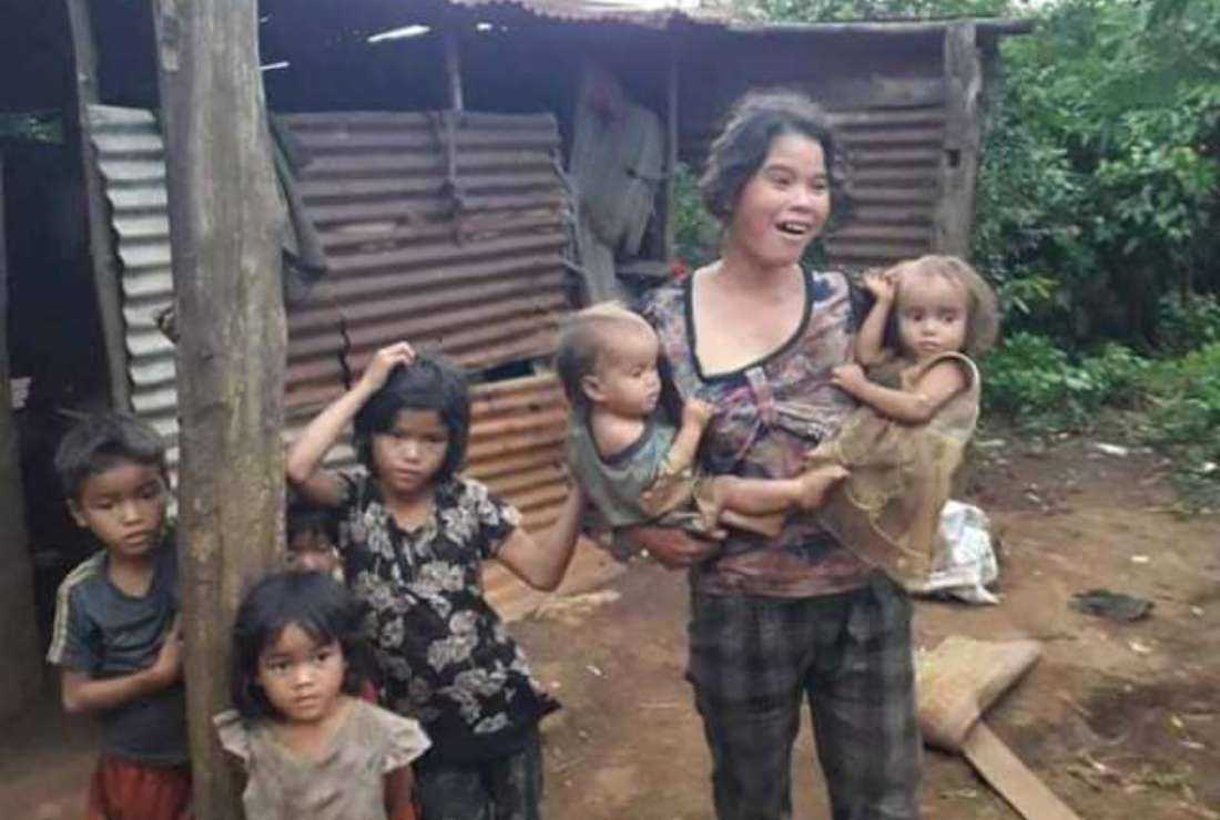 An ethnic woman seen with her children in Kontum Diocese