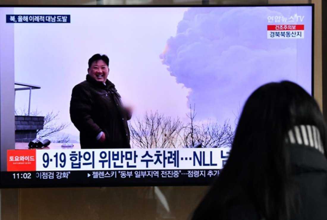 A woman watches a television screen showing a news broadcast with file footage of North Korean leader Kim Jong-un, at a railway station in Seoul on Dec. 31, 2022.  North Korea test-launched an intercontinental ballistic missile just hours before the leaders of South Korea and Japan were to meet at a Tokyo summit on March 16