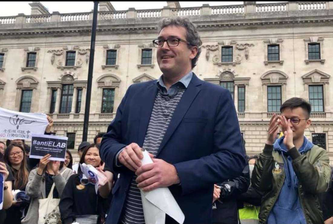 Benedict Rogers speaks to a group of demonstrators gathered in solidarity with the people of Hong Kong in Parliament Square in London, on June 16, 2019