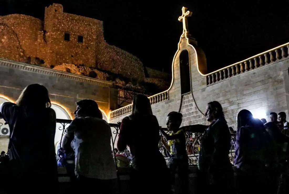Iraqi Orthodox Christians celebrate Easter Saturday at the church of the ancient Mar Matta monastery of St. Matthew in the village of Bashiqa, some 30km northeast of Mosul, on April 23, 2022
