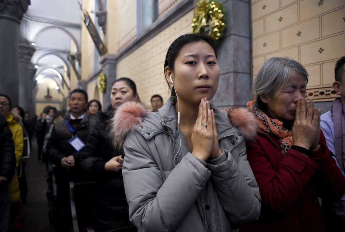 Chinese Christians attend Christmas Eve mass at a Catholic church in Beijing, on Dec. 24, 2016