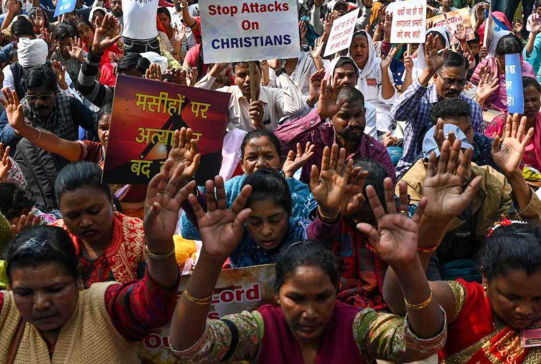 Activists and members representing the Christian community chant prayers during a peaceful protest rally in New Delhi on Feb. 19 protesting what they termed an increase in violence against Christians in various states of the country