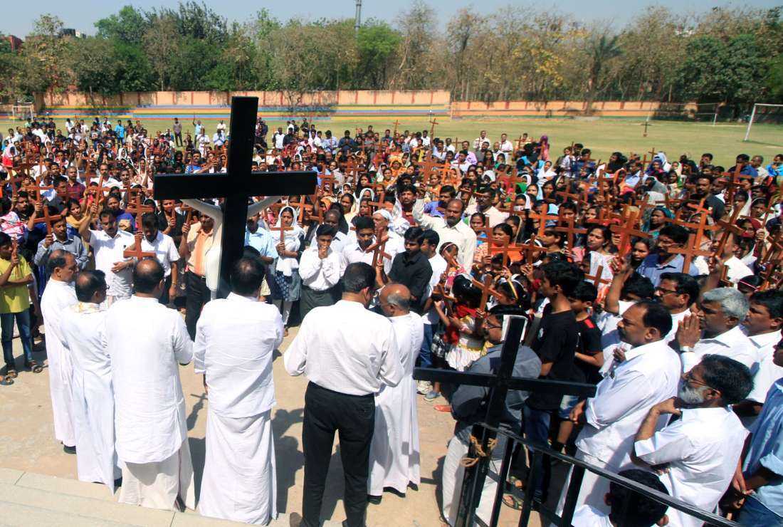 Christians pray during a Good Friday service in Delhi on March 30, 2018