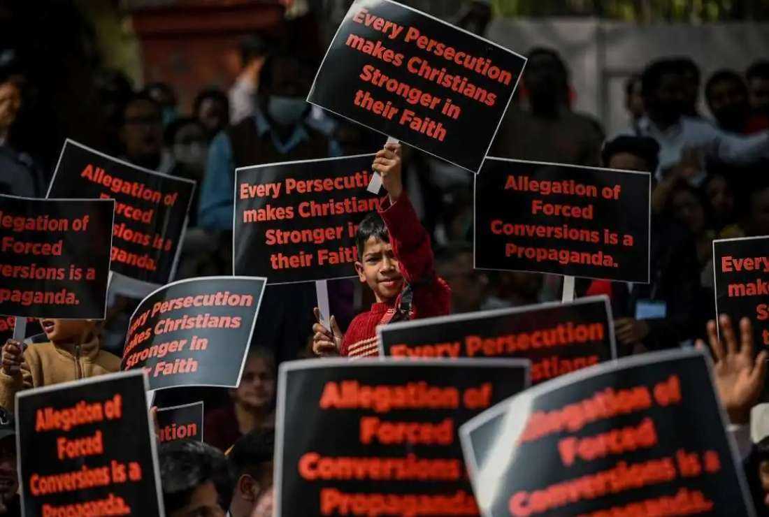 Activists and members representing the Christian community display placards as they take part in a peaceful protest rally against what they claim is an increase in hostility, hate, and violence against Christians in various states of the country, in New Delhi on Feb. 19