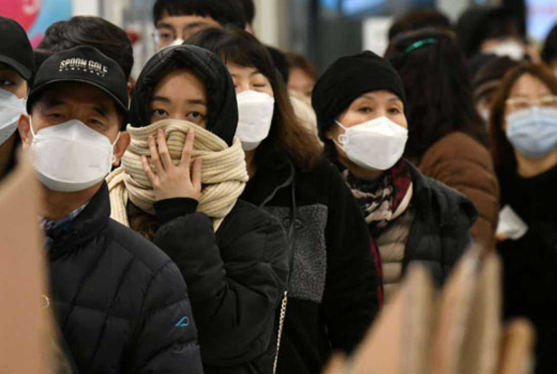 South Koreans wait in a line to buy face masks at a retail store in the southeastern city of Daegu on Feb. 25, 2020. The country has been grappling with low birth rates over the years