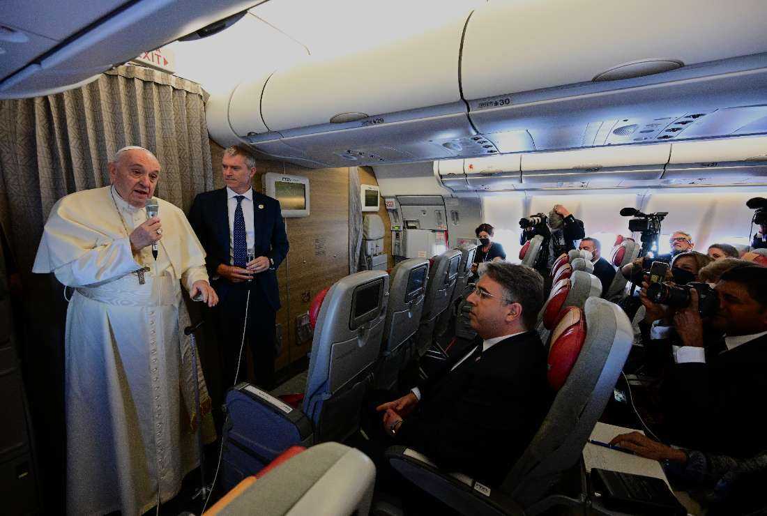 Pope Francis addresses journalists as he boards a flight to Edmonton International Airport in Alberta, western Canada, on July 24, 2022
