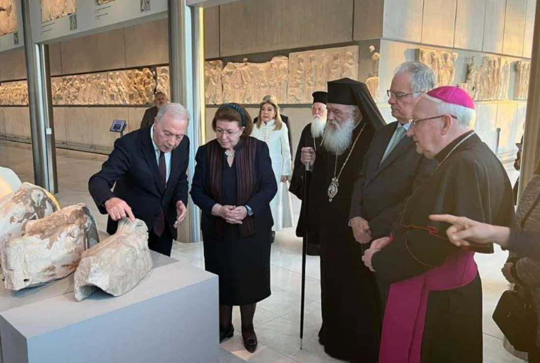 An expert gestures during the handover ceremony in Athens of the three fragments of the Parthenon donated by Pope Francis to the Archbishop of the Orthodox Church, His Beatitude Ieronymos II