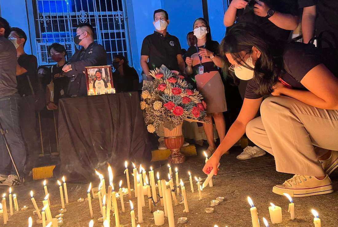 Students from Adamson University attend a prayer vigil on March 1 following the death of a freshman