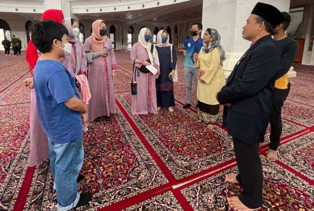 A group of youths visit a mosque in the Malaysian capital Kuala Lumpur as part of a state-sponsored program to promote harmony and tolerance among various faiths