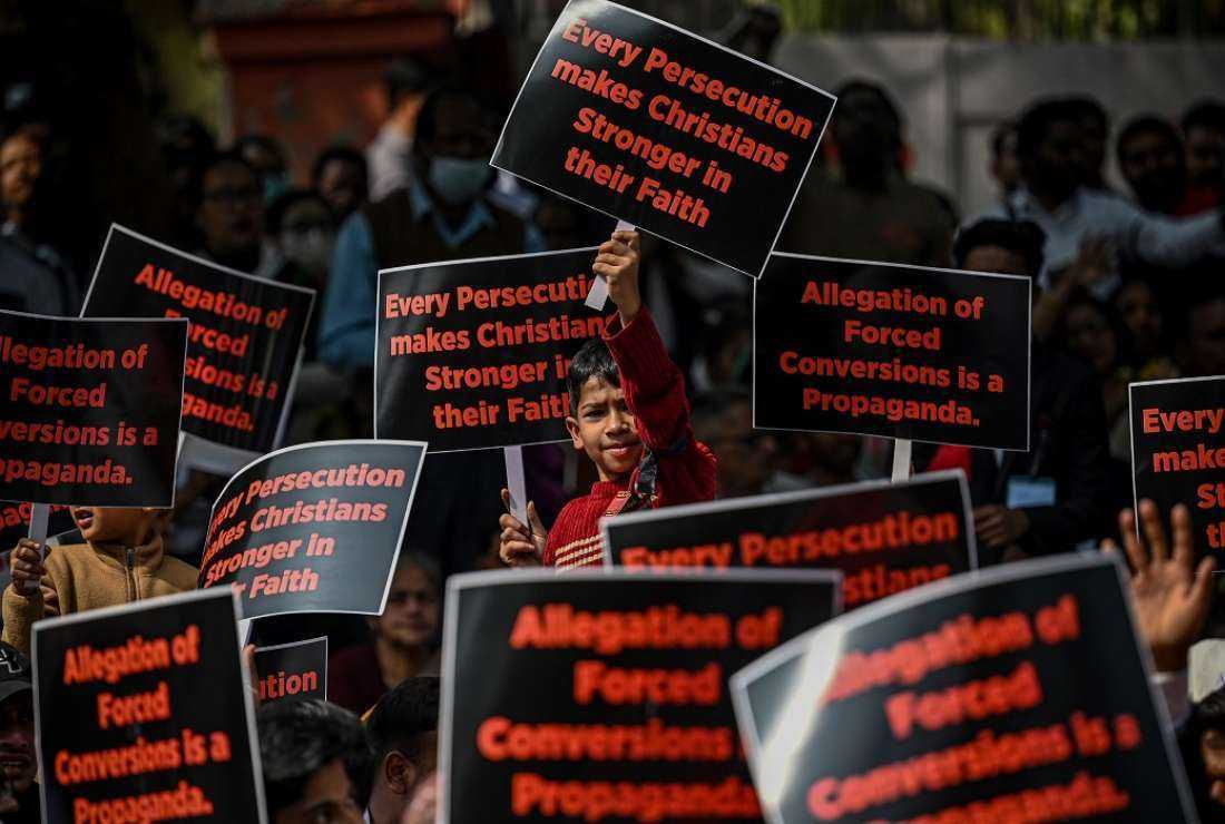 Activists and members representing the Christian community display placards as they take part in a peaceful protest rally against what they claim is an increase in hostility, hate, and violence against Christians in various states of the country, in New Delhi on Feb19, 2023