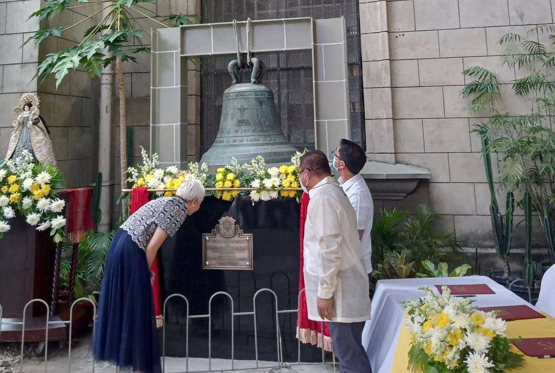 Church and government officials seen on April 22 near the belfry of the 435-year-old baroque-style Our Lady of Remedies Parish, more popularly known as Malate Church, which was declared an 'important cultural property' by the National Museum of the Philippines