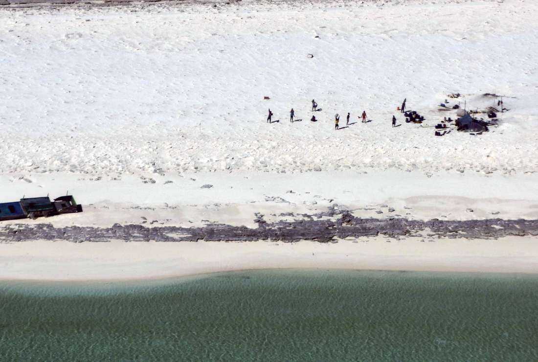 This undated handout photo received on April 19, 2023 from the Australian Maritime Safety Authority (AMSA) shows Indonesian fishermen who were shipwrecked on Bedwell Island off Australia's west coast for six days without food or supplies
