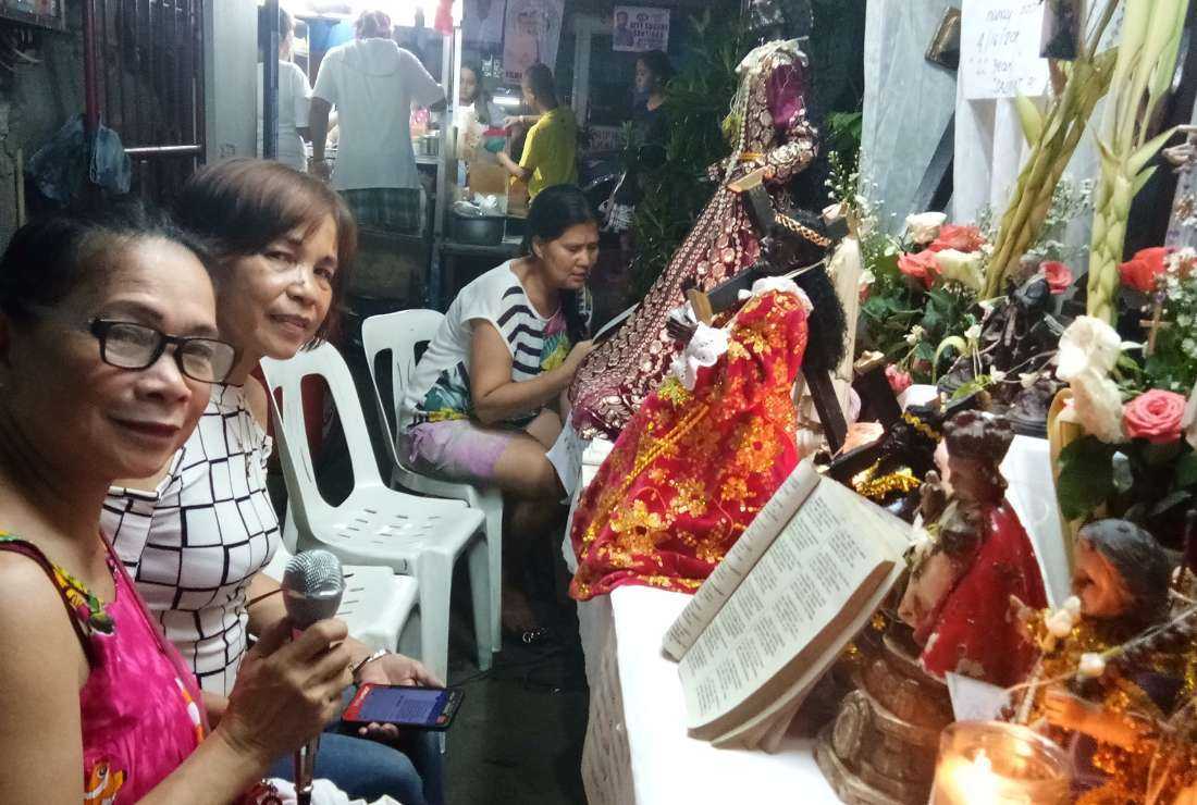 A group of women devotees gather for 'Pabasa,' a ritual chanting of the Passion of Jesus Christ, which is a time-honored tradition in the Philippines during Holy Week