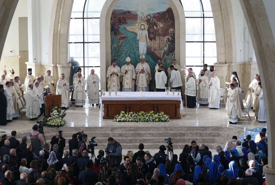 Pierbattista Pizzaballa (center), the Latin Patriarch of Jerusalem, leads a mass at the Church of the Baptism of Christ, near the baptism site of Al-Maghtas, where Jesus is believed by Christians to have been baptized by Saint John, in the Jordan river valley, some 60km southwest of the Jordanian capital Amman, on Jan. 13