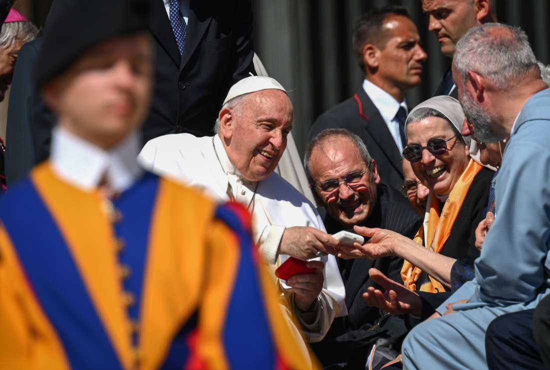 Pope Francis greets nuns at the end of his weekly general audience at Saint Peters' Square in the Vatican, on April 26