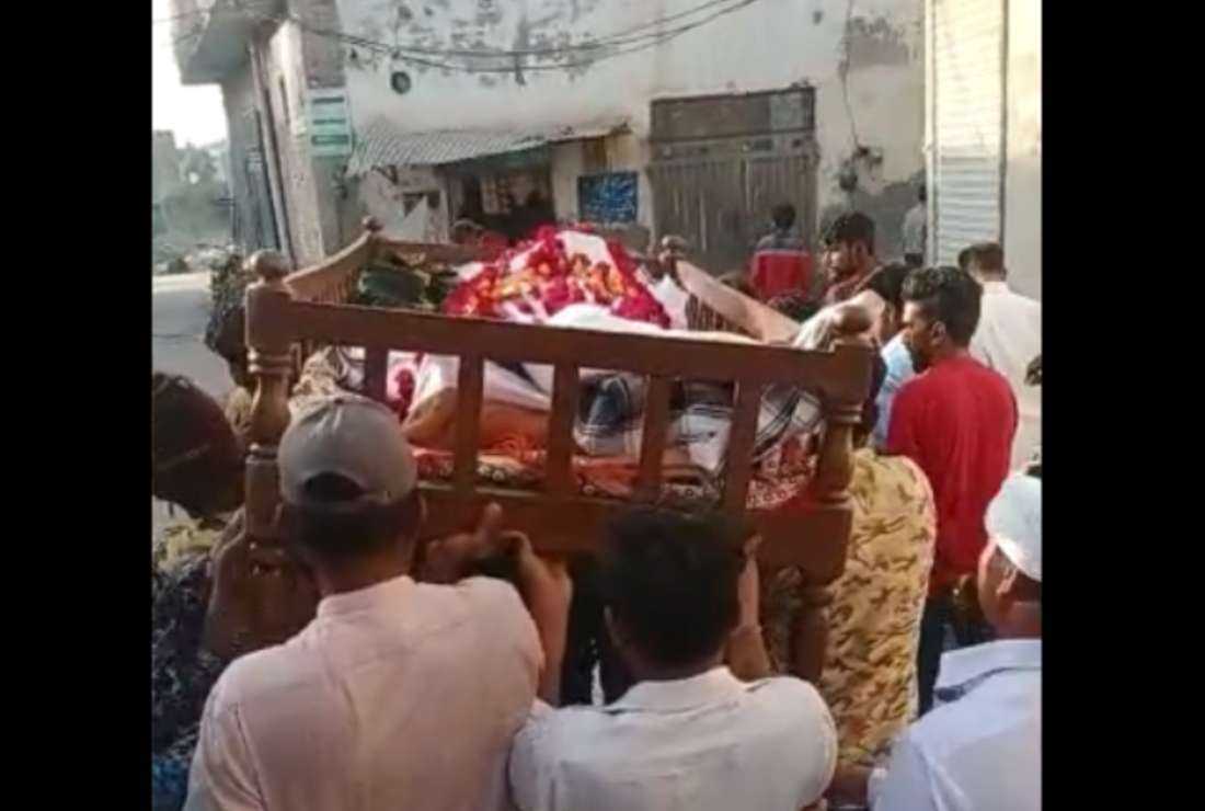 The body of Christian sanitary worker Pervaiz Masih is being carried for a funeral in his hometown in Okara, Punjab province of Pakistan on April 12