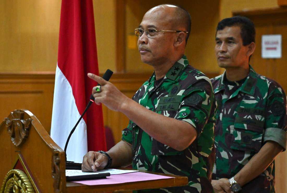 Indonesian military spokesman Julius Widjojono (left) speaks during a press conference at the military headquarters in Jakarta on April 16