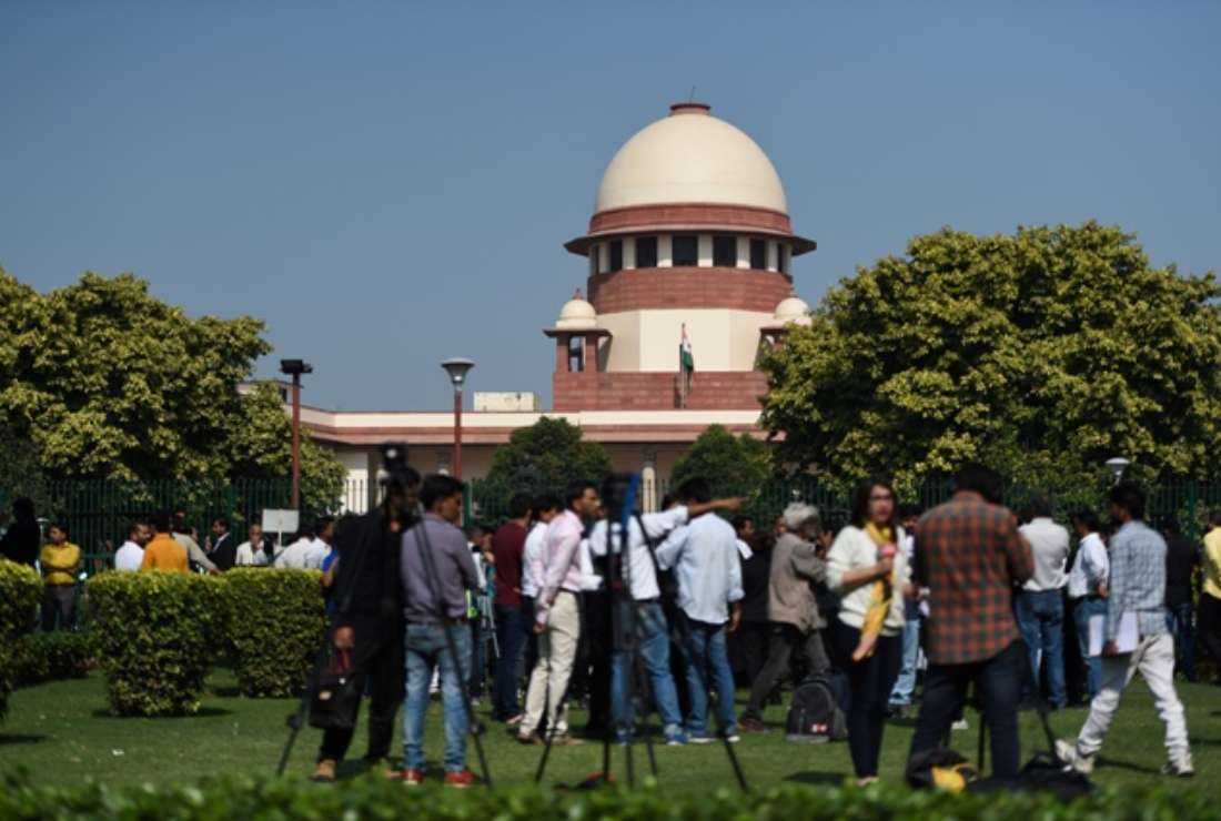 Members of the Indian media gather at the Supreme Court in New Delhi on Nov. 9, 2019