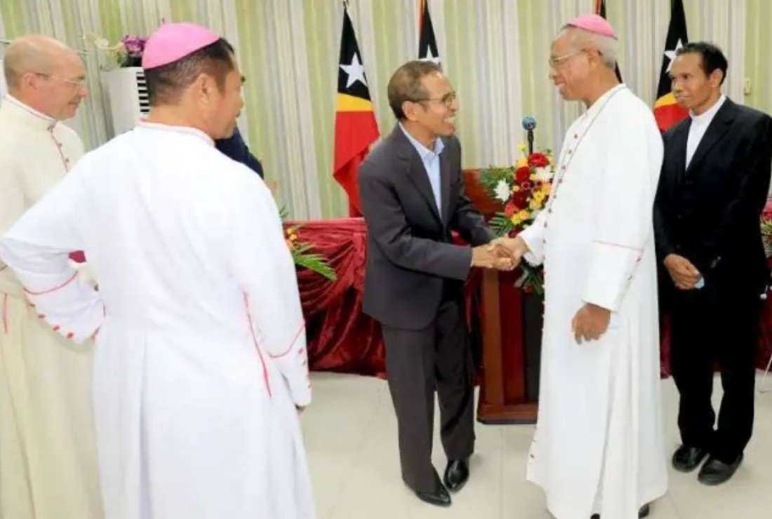 Bishop Norberto do Amaral of Maliana shakes hand with Prime Minister Taur Matan Ruak during a meeting in May 2022