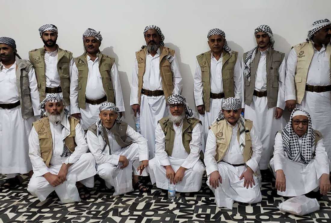 This handout picture obtained from the Twitter account of Abdulqader al-Mortada, head of the Huthi National Committee for Prisoners Affairs (NCPA), on April 8 shows 13 prisoners released by the Saudi authorities in exchange for a Saudi prisoner freed earlier, upon their arrival at Sanaa International airport in the Yemeni capital