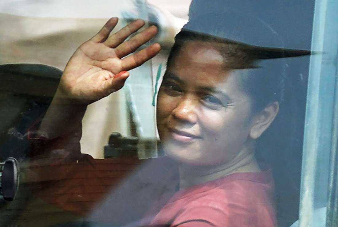 Cambodia union leader Chhim Sithar waves to supporters as she leaves Phnom Penh Municipal Court in Phnom Penh on May 25 after a court sentenced her to two years for leading a strike against the country's biggest casino to demand the reinstatement of workers laid off during the Covid-19 pandemic