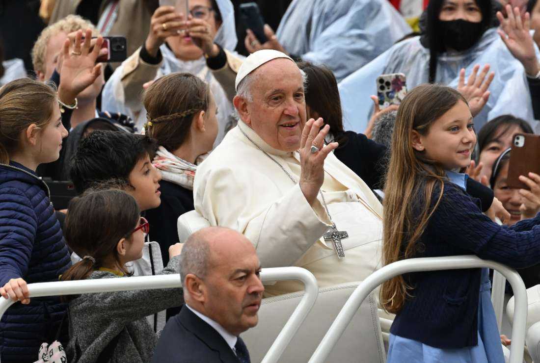 Pope Francis (center) arrives for the weekly general audience at St. Peter's Square in The Vatican on May 17