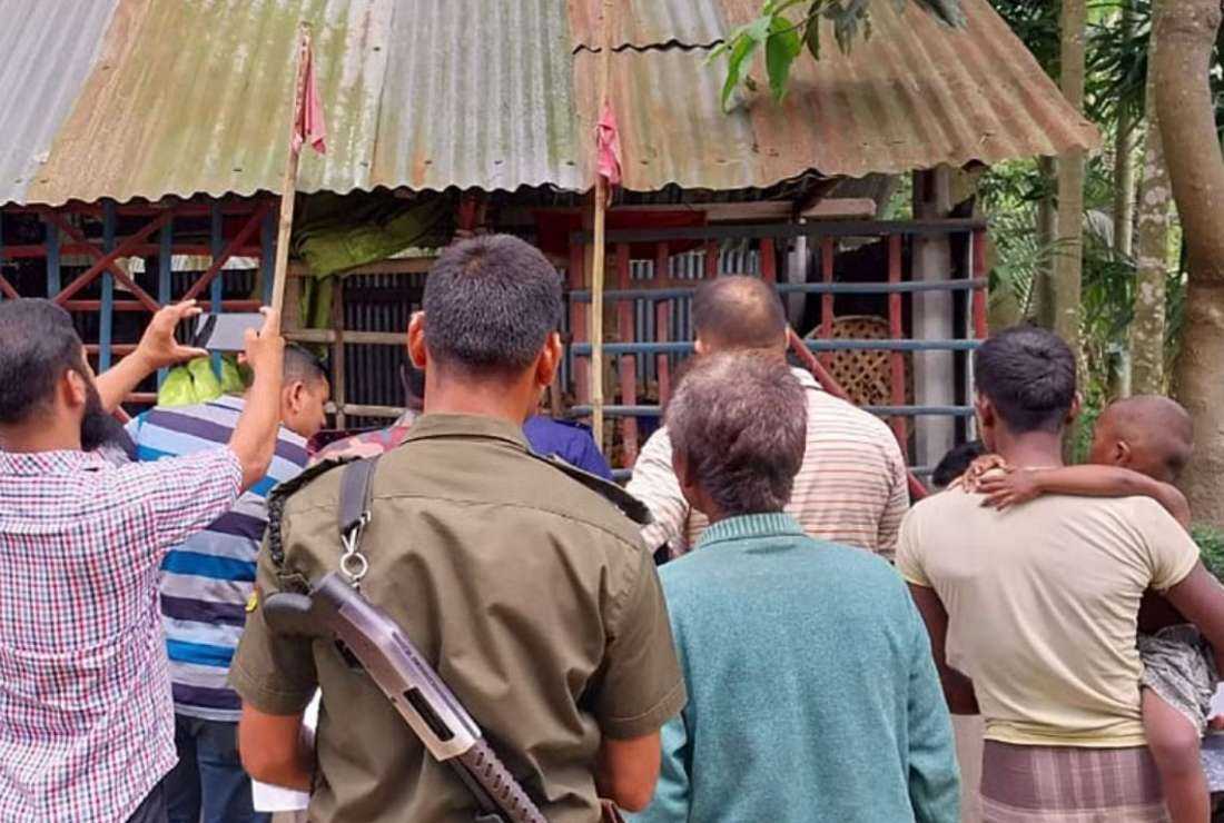 Police and minority Hindu members visit the four temples that were vandalized in the Fulbaria sub-district of Kurigram district in Bangladesh on May 