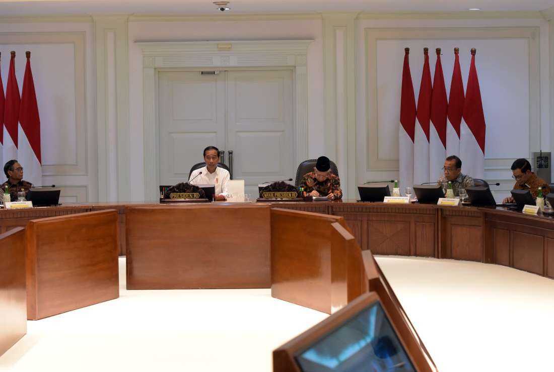 President Joko Widodo attends a meeting that decided on a non-judicial settlement for past gross human rights violations, in Jakarta on May 2