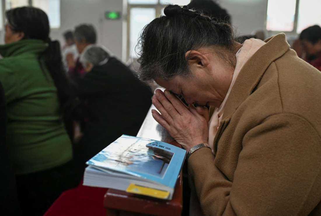 Catholic worshipers attend a morning mass on Easter Sunday at a Catholic church in a village near Beijing on April 4, 2021