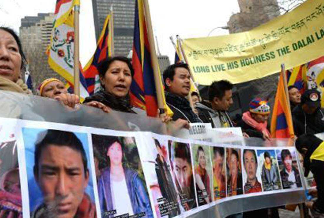 Tibetans take to the streets to protest religious repression in this file image