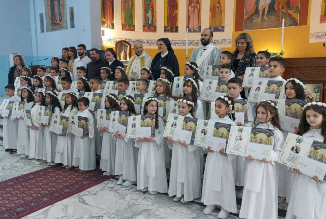 First Holy Communicants pose for a photo at the Syriac Maronite Parish of Ehden on May 2