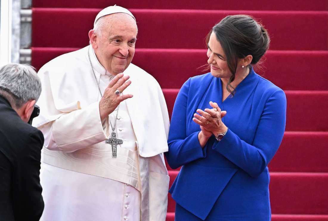 Pope Francis waves next to Hungary's President Katalin Novak during the farewell ceremony at Budapest International Airport on April 30 as his second visit to Hungary in less than two years comes to an end