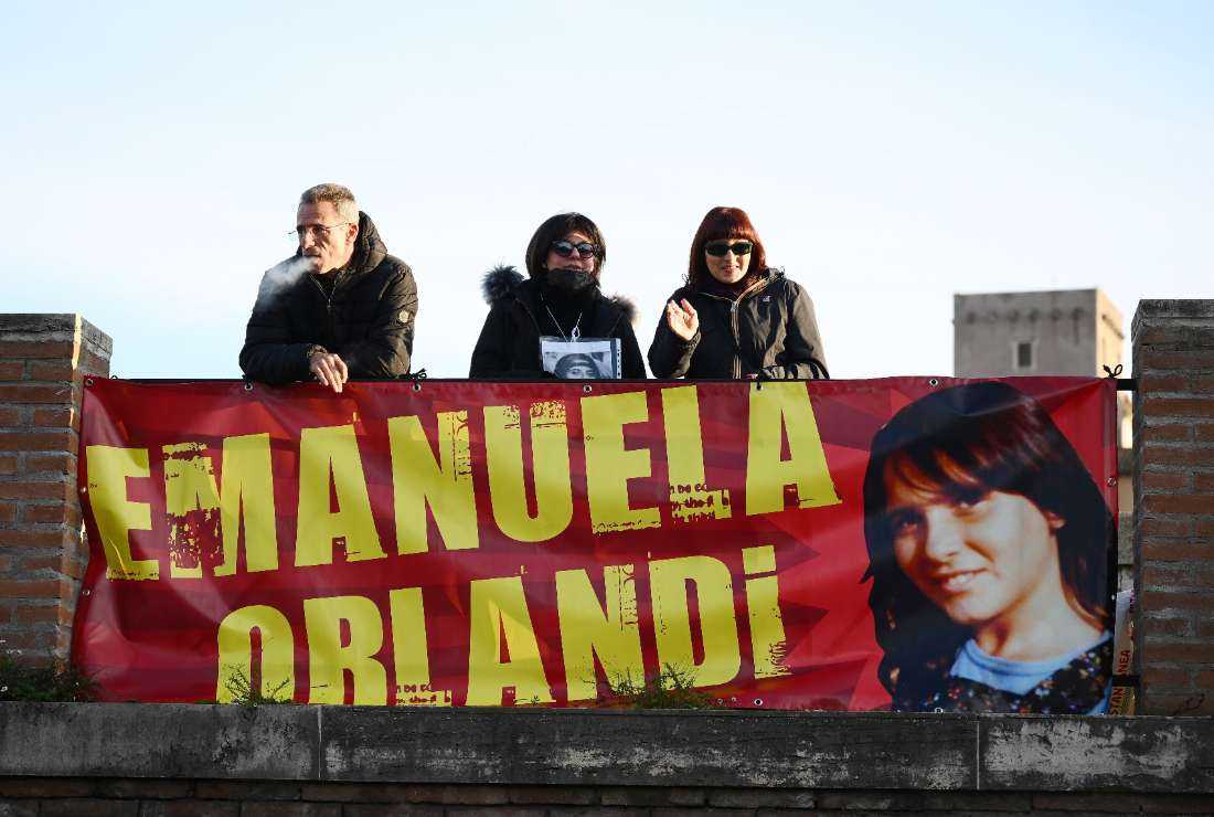 People hold a banner during a sit-in, in the memory of Emanuela Orlandi, a teenager who disappeared in 1983 in one of Italy's darkest mysteries, behind St Peter's Square in the Vatican in Rome on Jan. 14