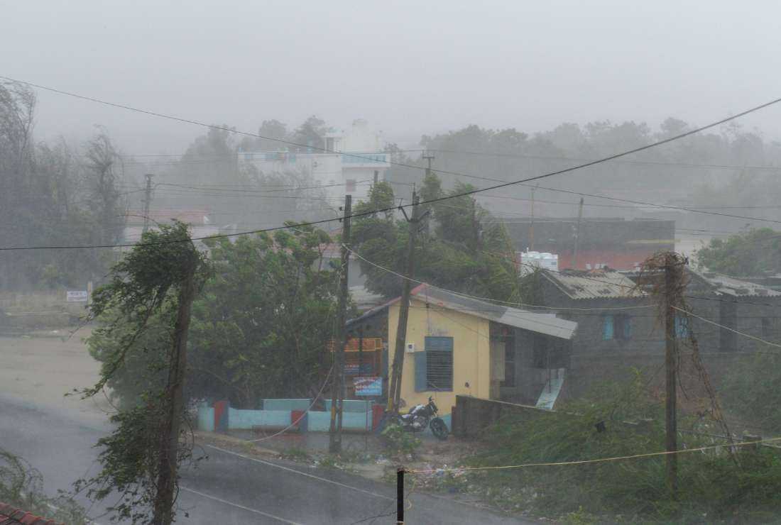 Heavy rain falls and strong winds blow through Mandvi town, some 100km southeast of Jakhau Port, on June 16, after cyclone Biparjoy made landfall