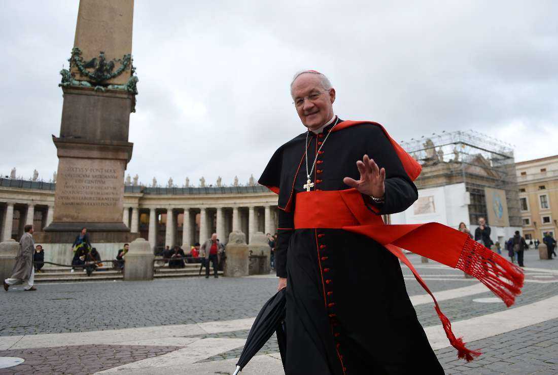 Canadian cardinal Marc Ouellet waves while walking on St Peter's Square before an afternoon meeting of pre-conclave at the Vatican on March 7