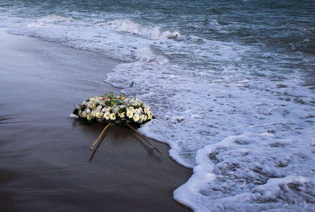 A wreath of flowers floats on the Mediterranean Sea, thrown by people who ended a protest march on the beach at the site of the shipwreck on March 11 in Steccato di Cutro, Calabria region, southern Italy, as part of the movement 'Stop the massacre, now!' (Fermare la strage, subito!) launched by the 'National Network February 26' created following the Feb. 26 shipwreck that killed at least 74 migrants, including children, in Steccato di Cutro