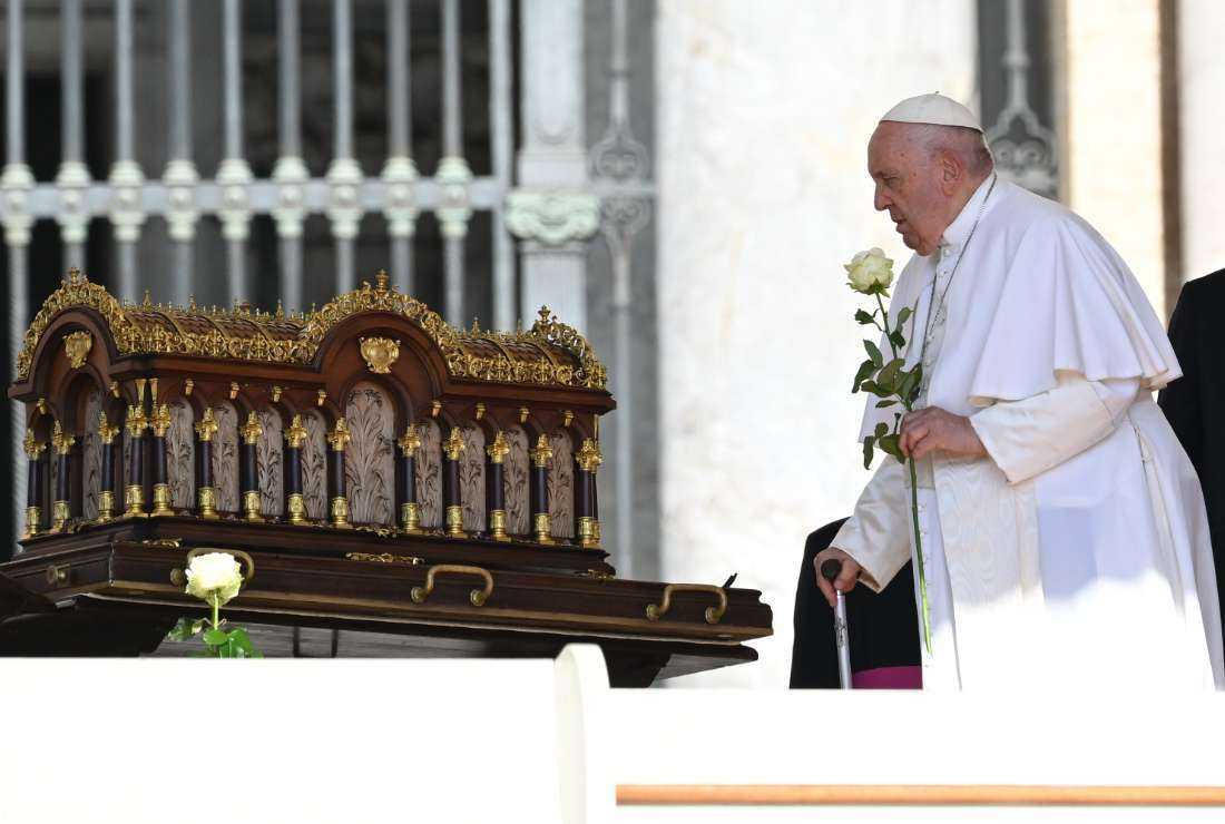 Pope Francis stands by the relics of Saint Therese of Lisieux, displayed during the weekly general audience on June 7 at St. Peter's Square in The Vatican, as part of The Journey of the Relics of Saint Therese, initiated in 1994, which has visited nearly 70 countries and continues today